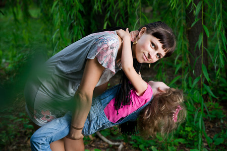  Young mother with child in nature.の写真素材