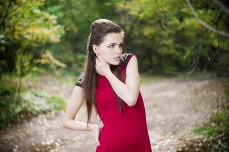 Portrait of beautiful young girl on nature.の写真素材