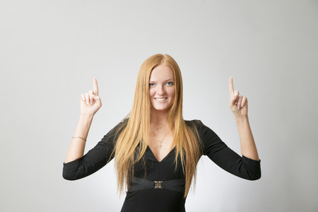 Portrait of business woman on a gray の写真素材