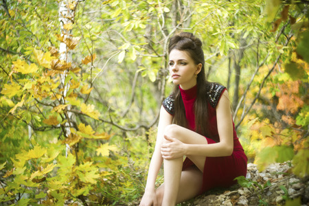 Portrait of beautiful young girl on nature.の写真素材