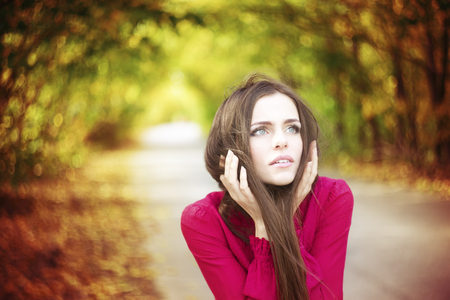 Portrait of beautiful young girl on nature の写真素材