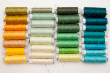 Background of colorful spools of thread.  Top view
