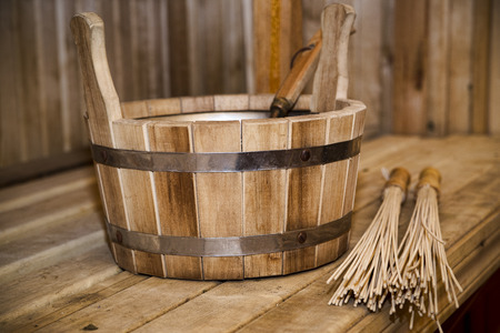 Sauna, bath accessories. Wooden bucket and sticksの写真素材