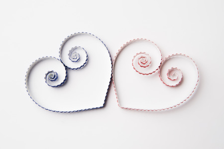 Quilling paper on white cardboard. Background with hearts for Valentine's day.の写真素材