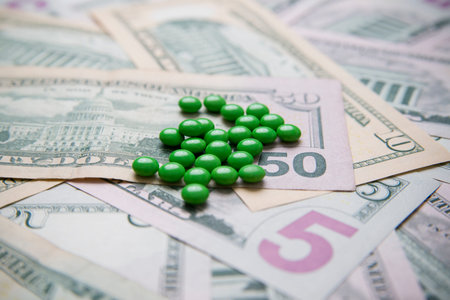 Pills on a background of money. Medicine. Concept.