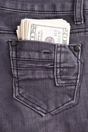 Money in the jeans pocket. Dollars. Twenty-dollar billsの写真素材