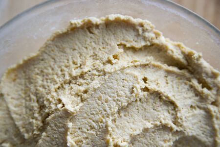 Hummus in a transparent plateの写真素材