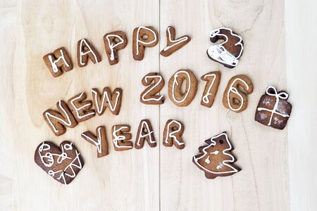 Christmas cookies on a wooden table. Happy New Year 2016の写真素材