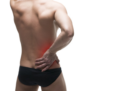 Kidney pain. Man with backache. Pain in the human body. Muscular male body. Isolated on white background with red dotの写真素材