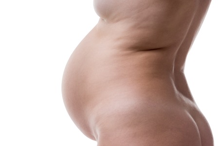 Art nude, sexy naked pregnant woman isolated on white background, pregnancy conceptの写真素材