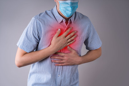 Man with  symptoms on gray background, studio shot