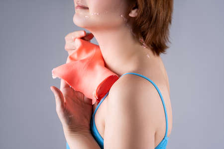 Alginate body mask, neck lifting, beauty treatments for body care on gray backgroundの写真素材