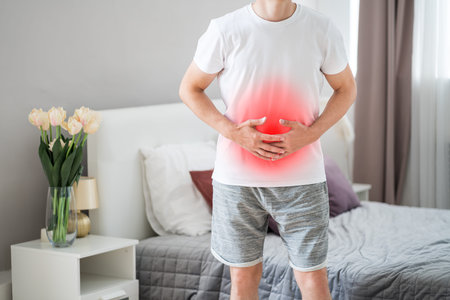 Stomach ache, man with abdominal pain suffering at home