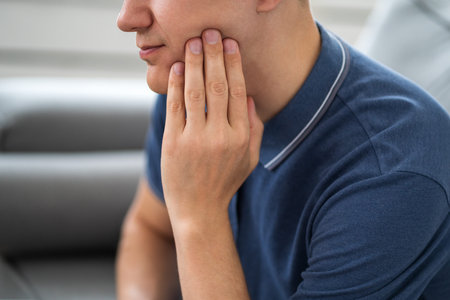 A man with toothache, periodontal disease in wisdom teeth, health problems concept