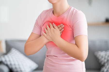 Heart attack, woman with chest pain at home, health problems concept