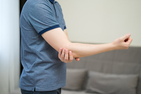 Diseases of the elbow joint, bone fracture and inflammation, man suffering from pain in cubit, health problems conceptの写真素材