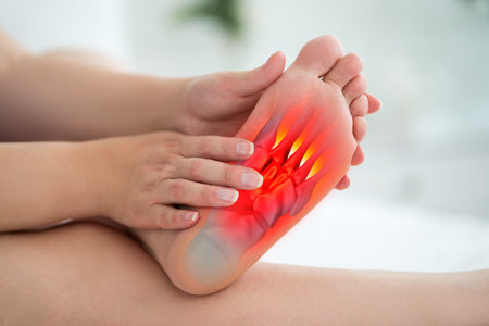 Joint diseases, hallux valgus, plantar fasciitis, heel spur, woman's leg hurts, pain in the foot, female feet closeup, health problems conceptの写真素材