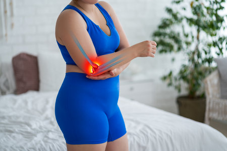 Diseases of the elbow joint, bone fracture, inflammation and dislocation, woman suffering from pain in cubit, dislocated arm, health problems conceptの写真素材
