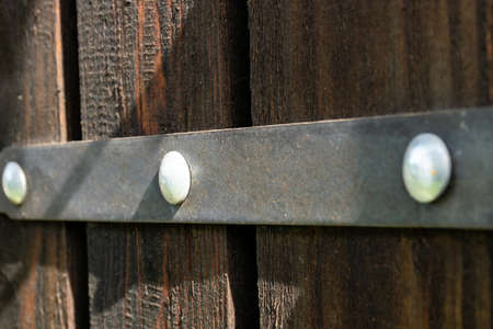 Wooden boardson on the facade of the building as a textureの写真素材