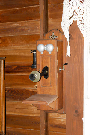 A vintage, wooden crank style telephoneの写真素材