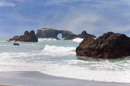 Stunning Arch Rock in late winter off the Pacific coast in Bodega, Californiaの写真素材