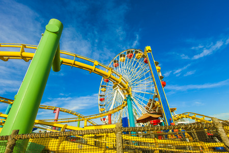 The Santa Monica Pier is a large double-jointed pier located at the foot of Colorado Avenue in Santa Monica, California and is a prominent, 100-year-old landmark. The Ferris Wheel is part of Pacific Park, a family amusement parkのeditorial素材