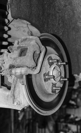 Car brake pads and wheels close-up. Auto service industry.