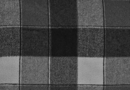 black and white checkered fabric as background, closeup of photo