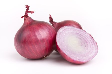 Vibrant red salad onion isolated against white background.の写真素材