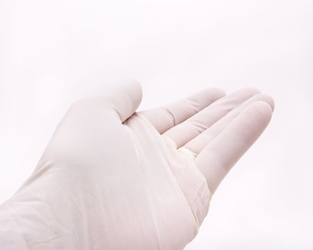 Mans hand gesture wearing white surgical glove against white background.の写真素材