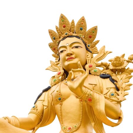 Golden Buddah statue of Green Tara a Tibetan buddhist God against white background.の写真素材