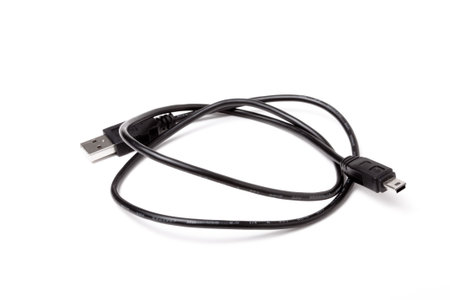 Black USB Cable coiled up isolated against white background.