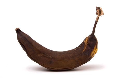 Brown Over Ripe Banana isolated against white background.の写真素材
