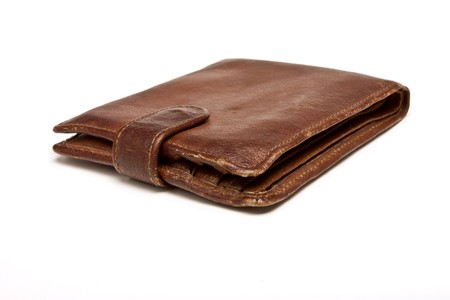 Worn Leather Wallet from low perspective financial wealth or poverty concept.の写真素材