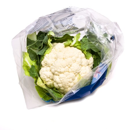 Pre Packed Cauliflower in plastic bag isolated against white background.の写真素材