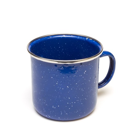 Blue Enamel Tin Cup from low perspective isolated against white background.の写真素材