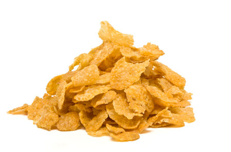 Pile of Corn Flakes from low perspective isolated against white.