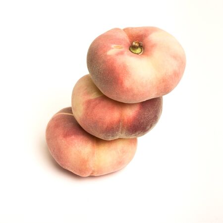 Exotic Flat peach also known as donut, chinese or saturn peach.の写真素材
