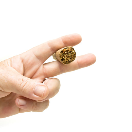 male hand holding Large fat cigar isolated on white background.の写真素材