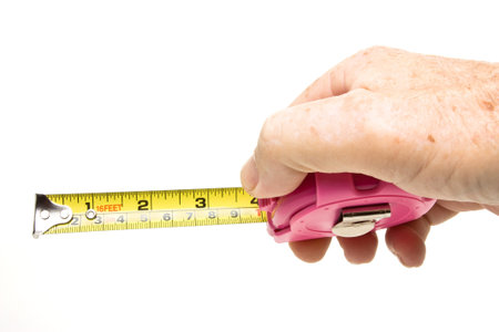 Shocking Pink Girly tape measure isolated on white.