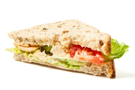 Vegetarian Sandwich of cheese, tomato and lettuce on brown Granaray bread.の写真素材