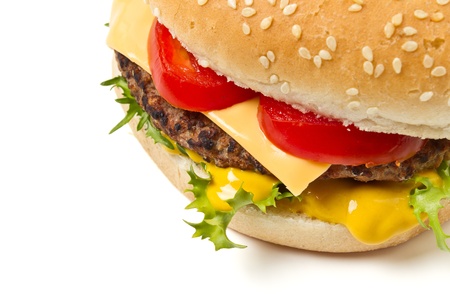 Cheeseburger and Mustard in sesame seeded bun isolated on white.の写真素材