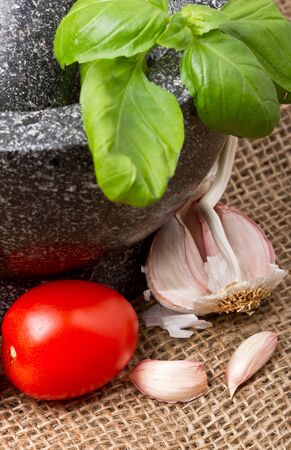 Basic bruschetta ingredients of tomato, basil, garlic and Olive oil.の写真素材