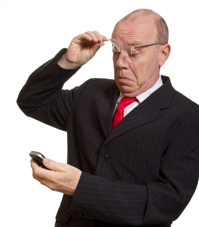 Expressive senior businessman isolated on white shortsighted conceptの写真素材