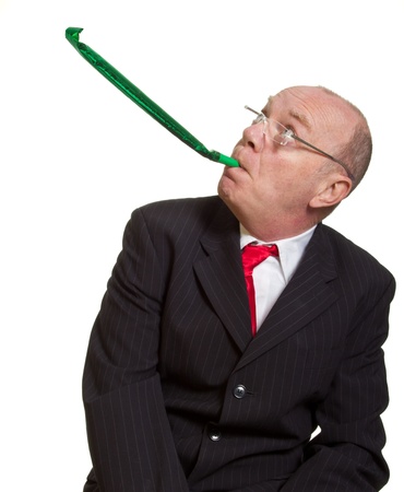 Expressive senior businessman isolated on white party pooper conceptの写真素材