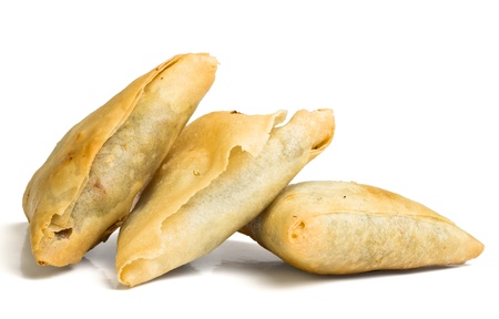 Cooked golden Samosa's from low perspective isolated on white.の写真素材