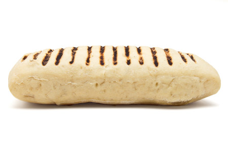 Single toasted panini from low perspective isolated on white.の写真素材