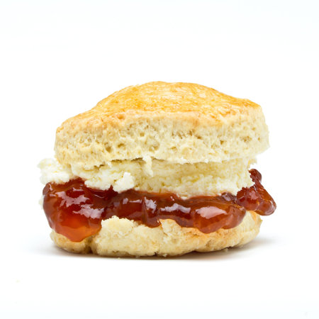 Cream tea Scone with jam from low perspective isolated on white.の写真素材