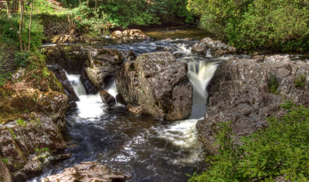 Hdr image of Betws y Coed bridge and waterfall in Wales.の写真素材