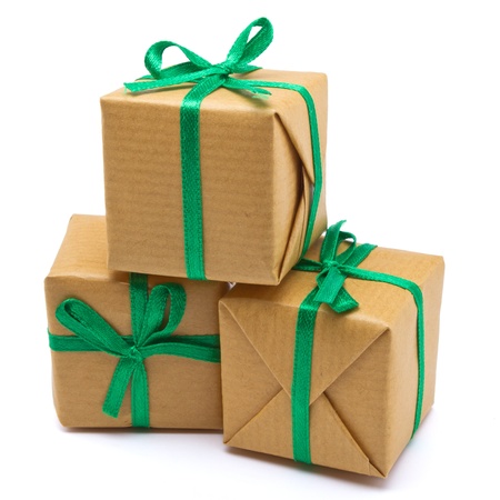 Pile of Gift boxes wrapped in brown paper isolated on white.の写真素材